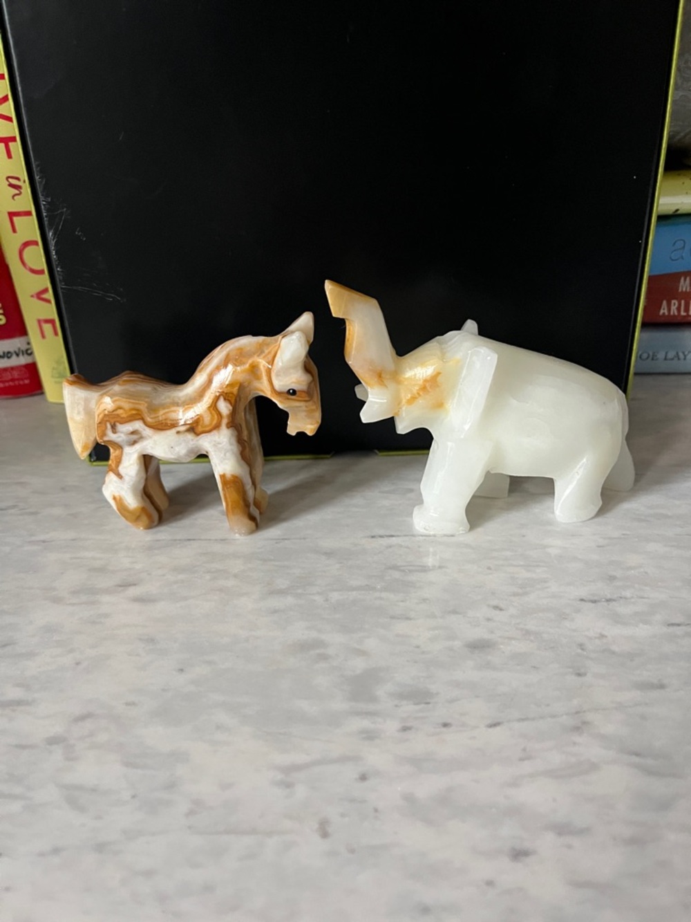 Marble horse & elephant pair 
No chips or scratches cabinet kept